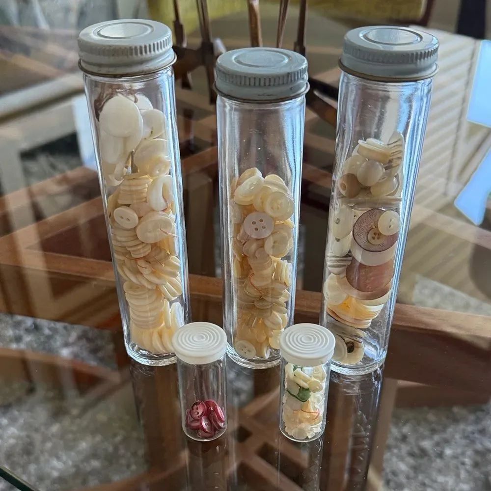 5 glass cylinders of mother of pearl buttons